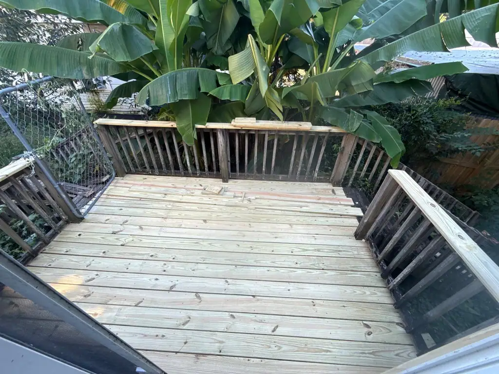 New pressure-treated deck with fresh railings