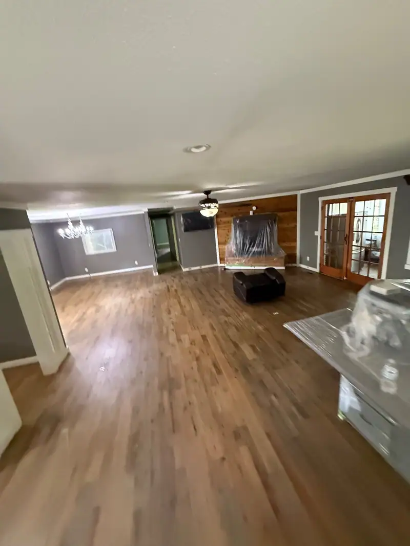 Open living area with refinished hardwood floors