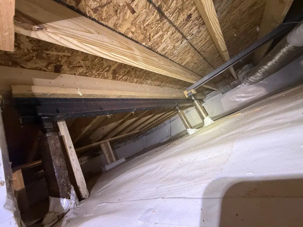 New framing sistered to old joists under the floor