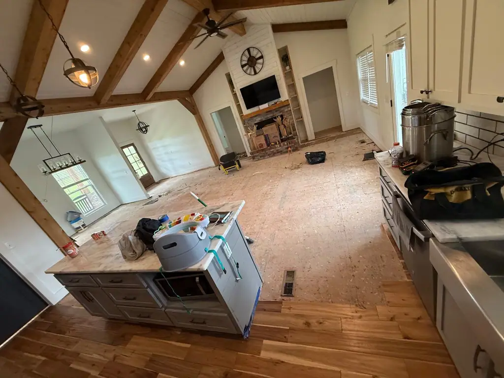 Open kitchen with the flooring pulled up to the subfloor during a water job
