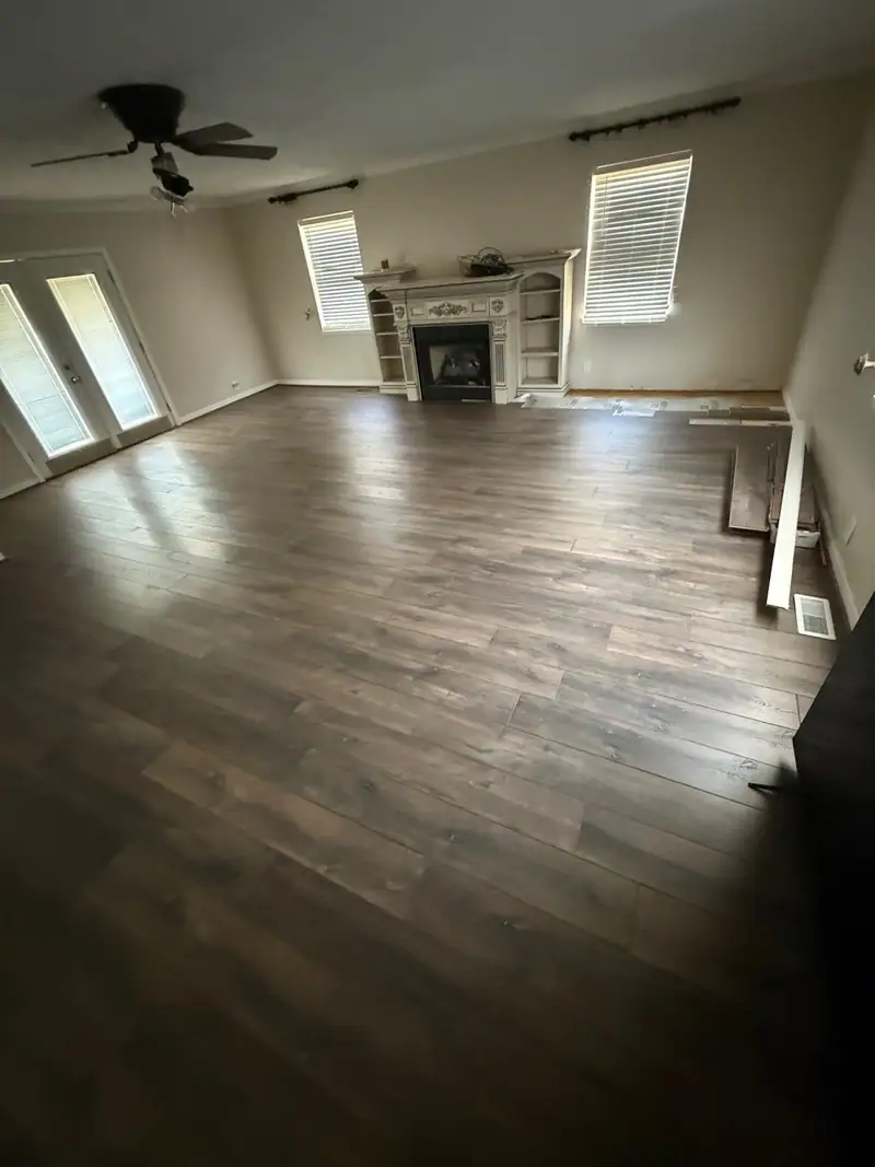 Living room finished with new plank flooring and fresh paint