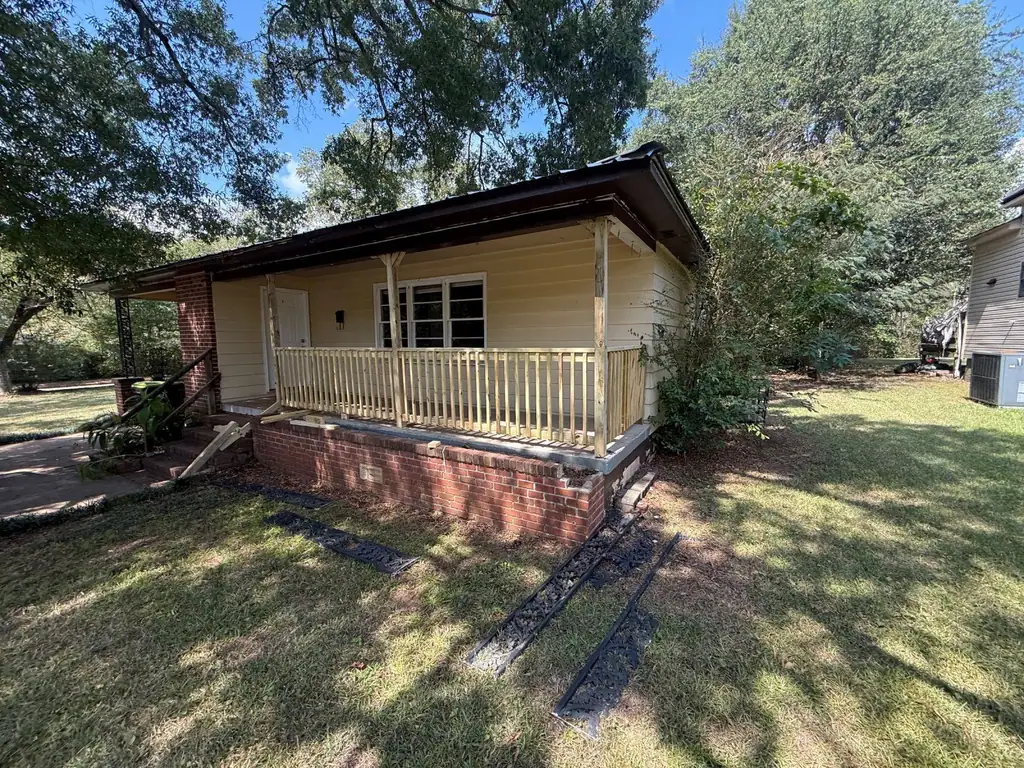 Yellow house with a new porch railing