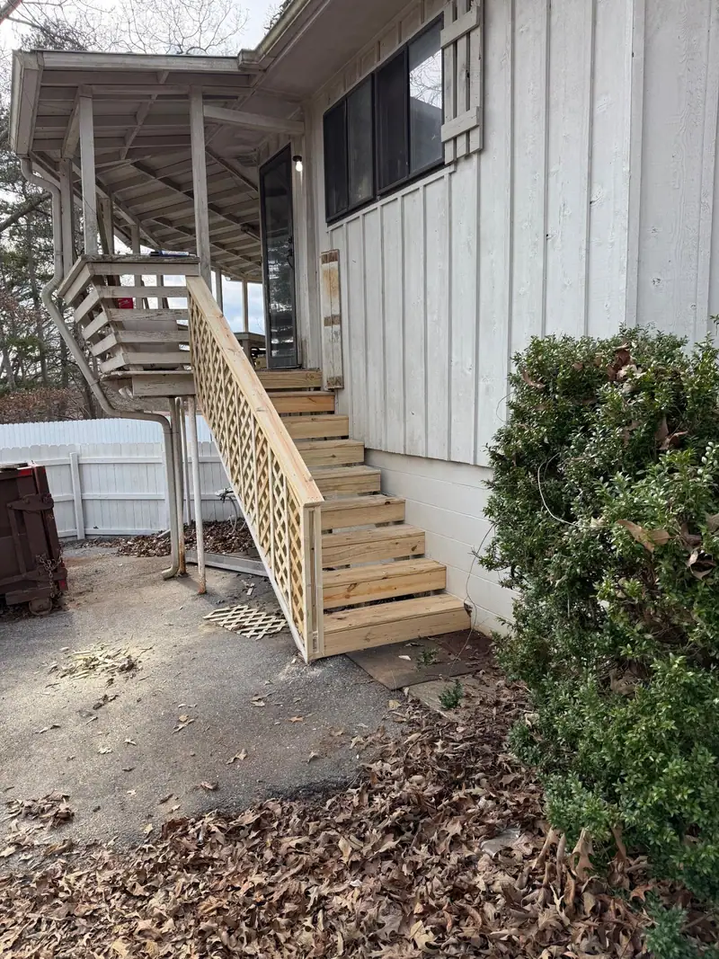 New exterior stairs and railing up to a second-floor deck