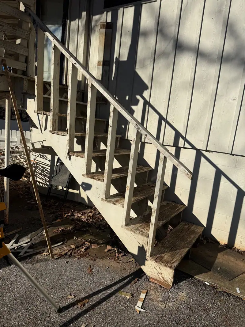 Old weathered exterior stairs before replacement