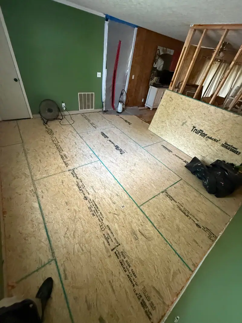 New subfloor going down in a room torn back to the studs