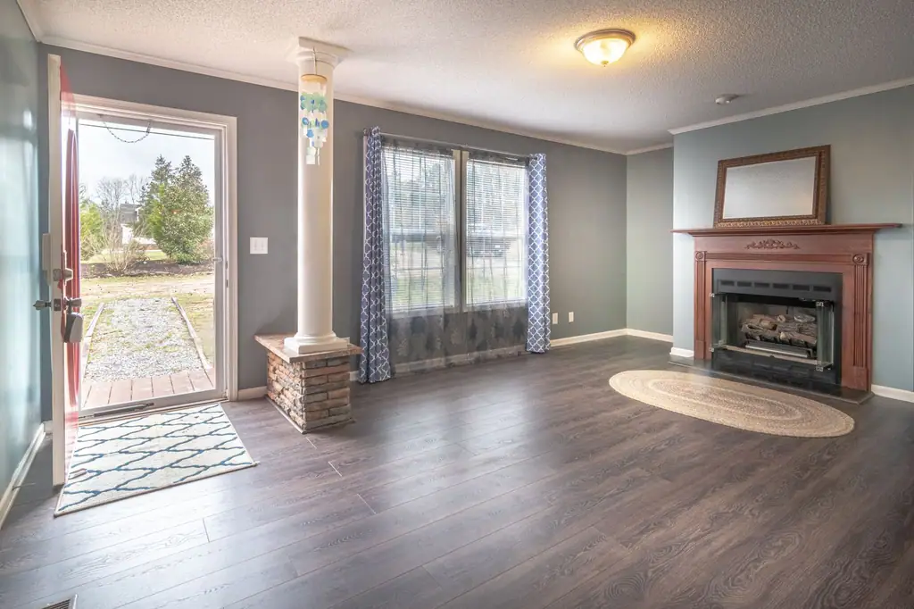 Bright, clean living room with a fireplace